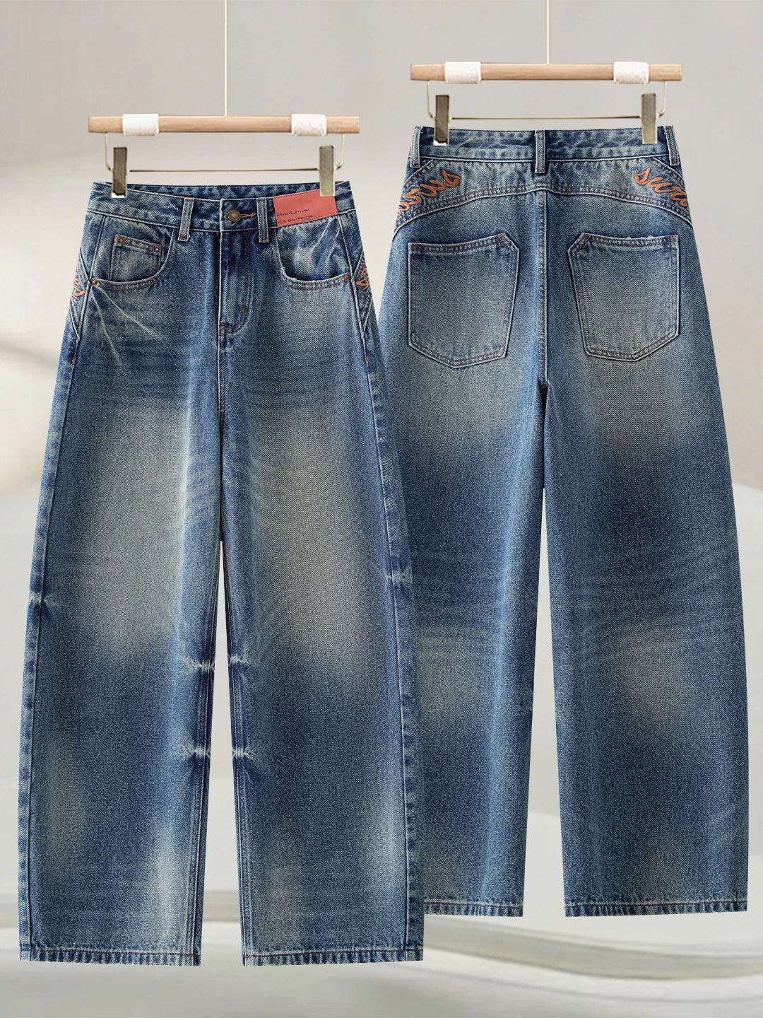Korean version of the design sense embroidered scimitar jeans women's 2026 autumn new loose meat covering and thin versatile wide-leg pants