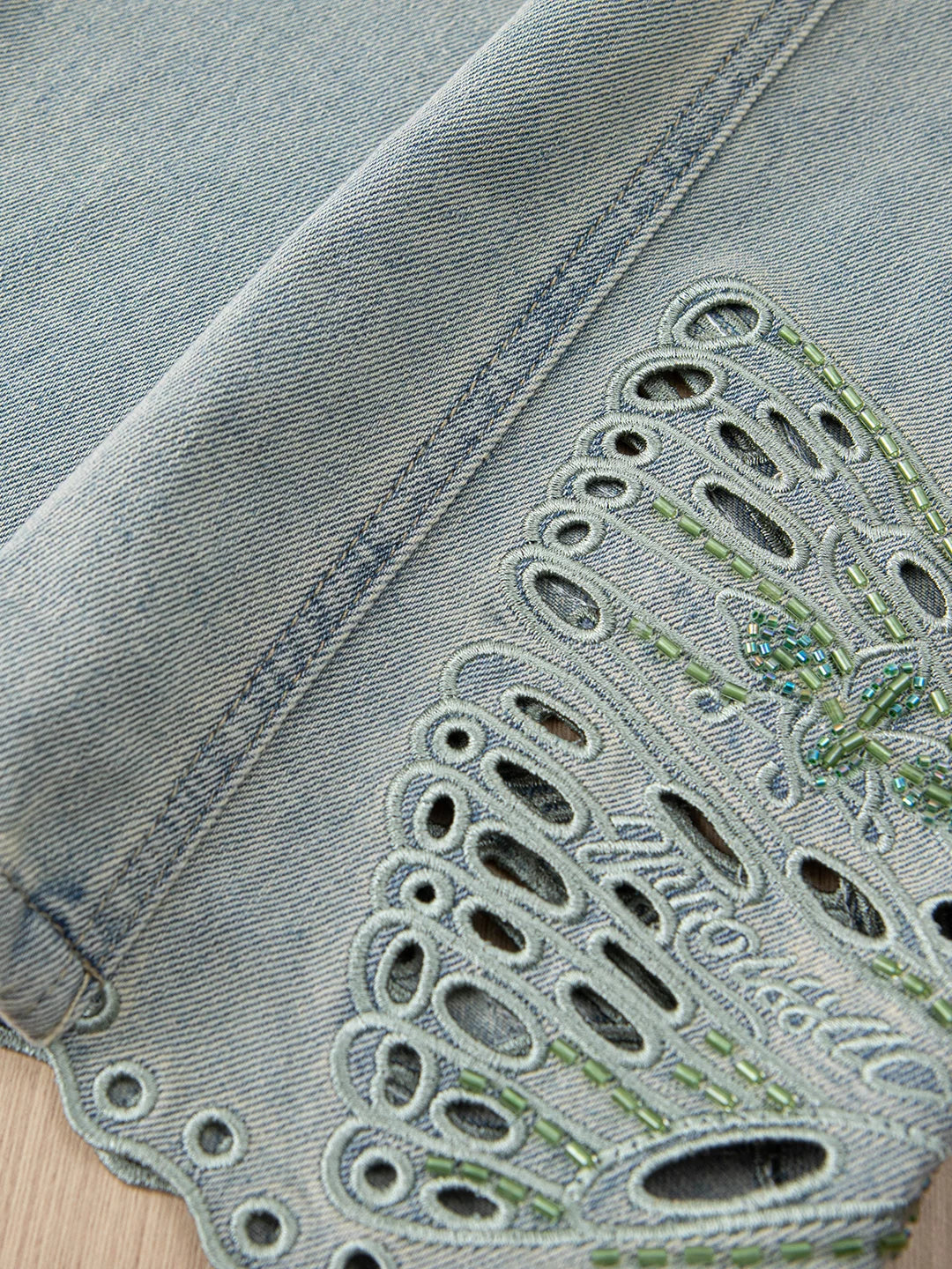 Design sense hollow embroidered jeans women's thin 2026 summer small loose hip covering thin scimitar nine-point pants