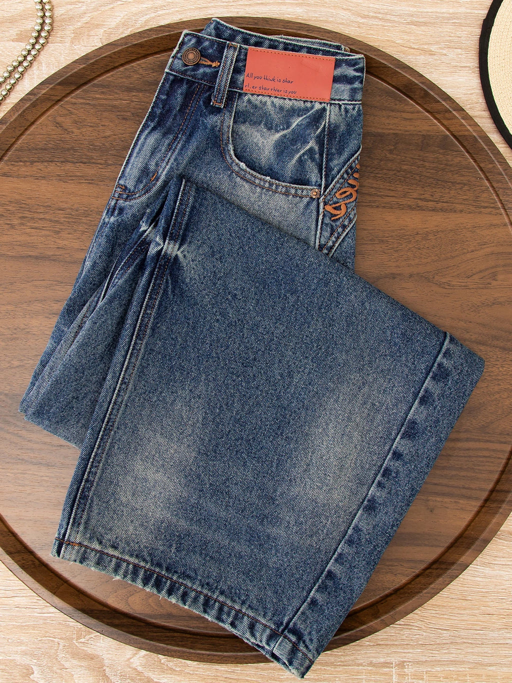 Korean version of the design sense embroidered scimitar jeans women's 2026 autumn new loose meat covering and thin versatile wide-leg pants