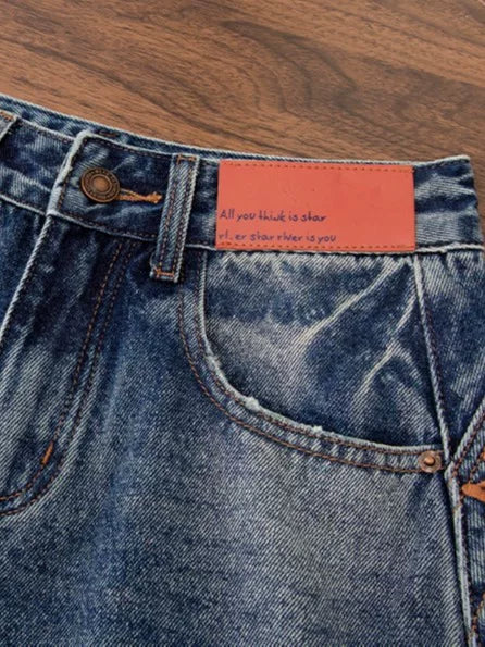 Korean version of the design sense embroidered scimitar jeans women's 2026 autumn new loose meat covering and thin versatile wide-leg pants